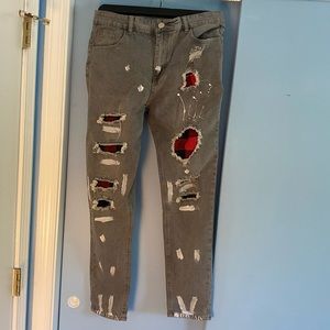 Ripped jeans with patchwork underneath